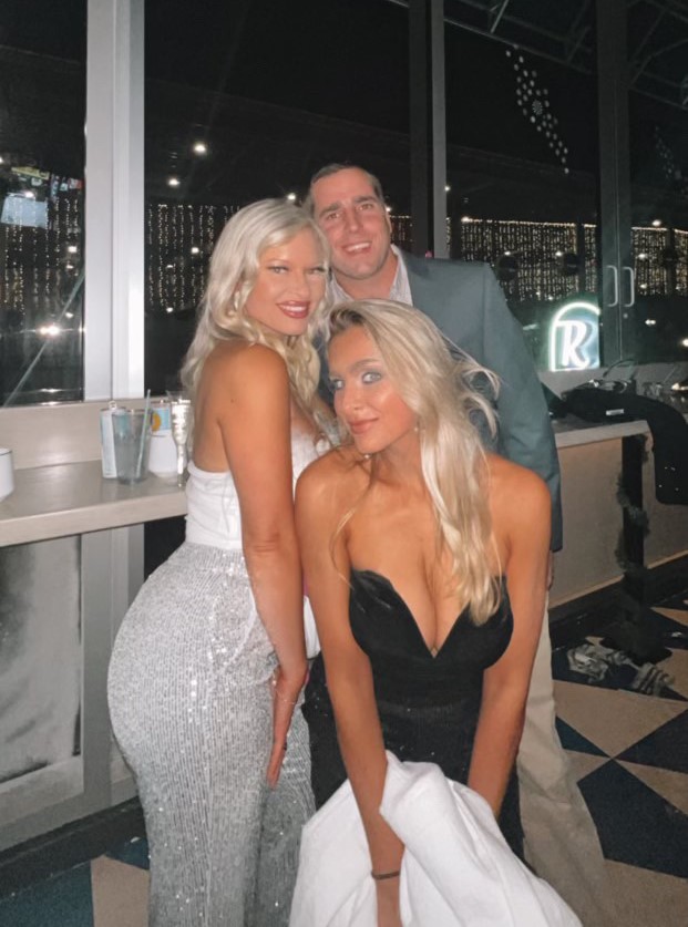 a woman standing in front of a window