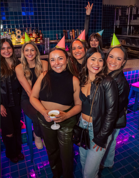 a group of people posing for a photo