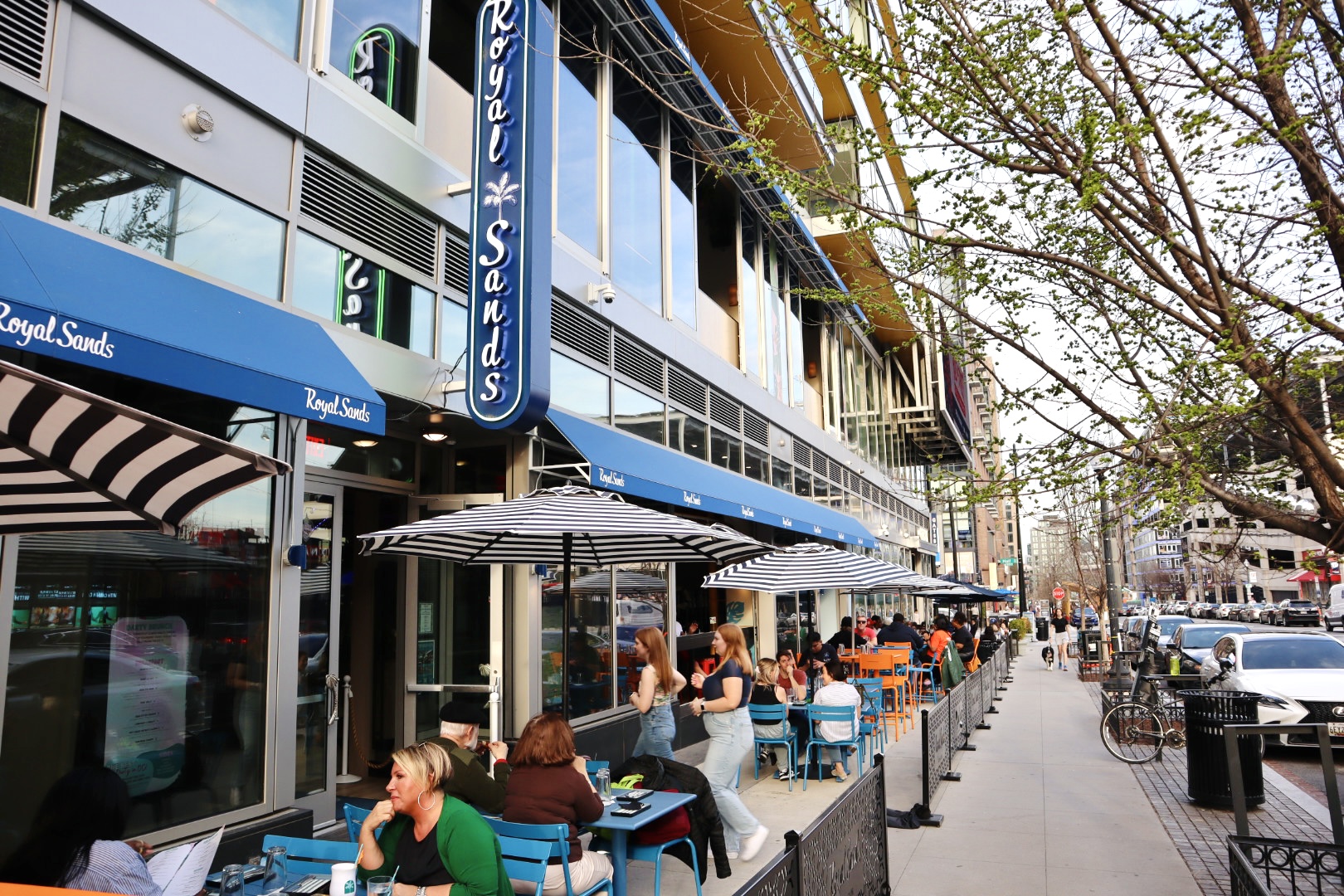 a group of people sitting at a bus stop