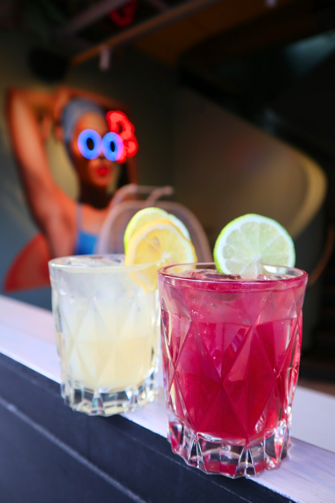 a cup of coffee and a glass of beer on a table