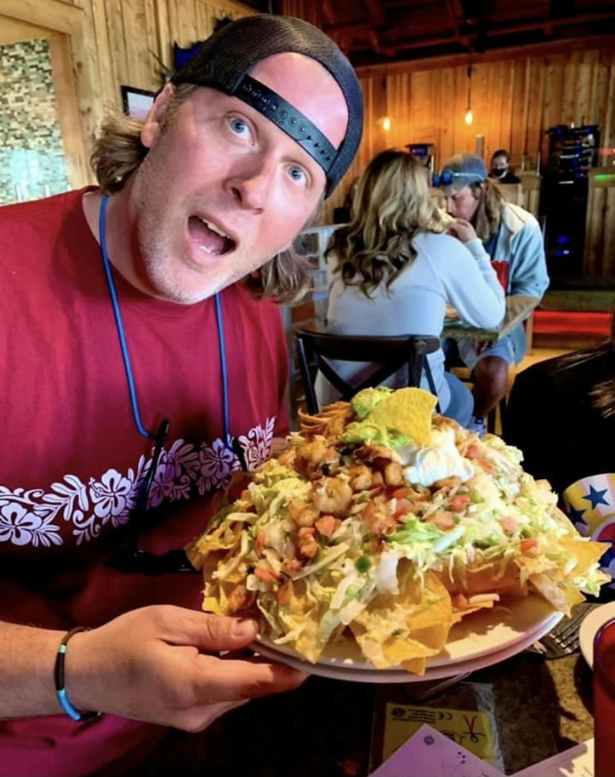 a man in front of a plate of food