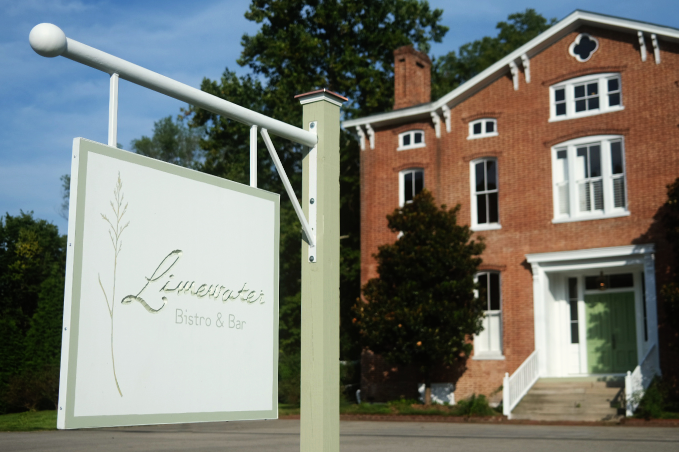 a sign in front of a building