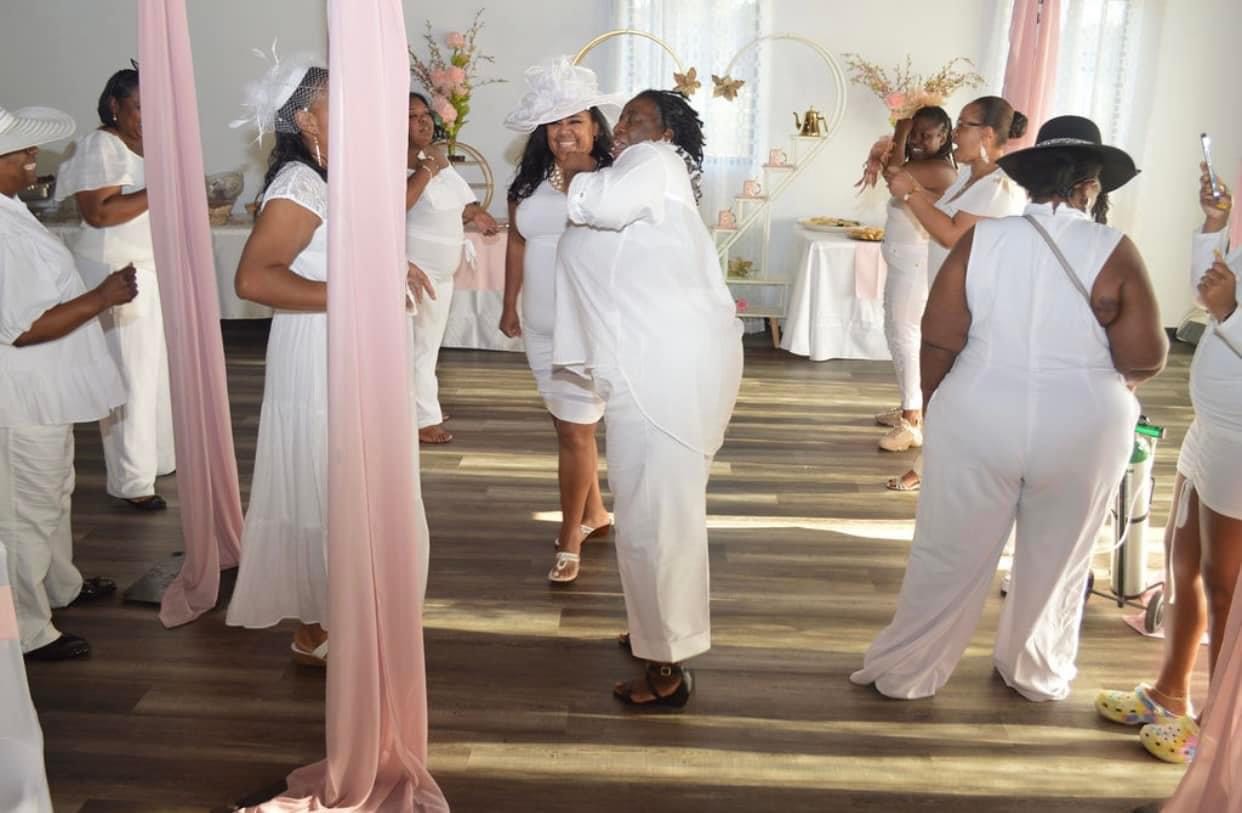 a group of people standing in a room