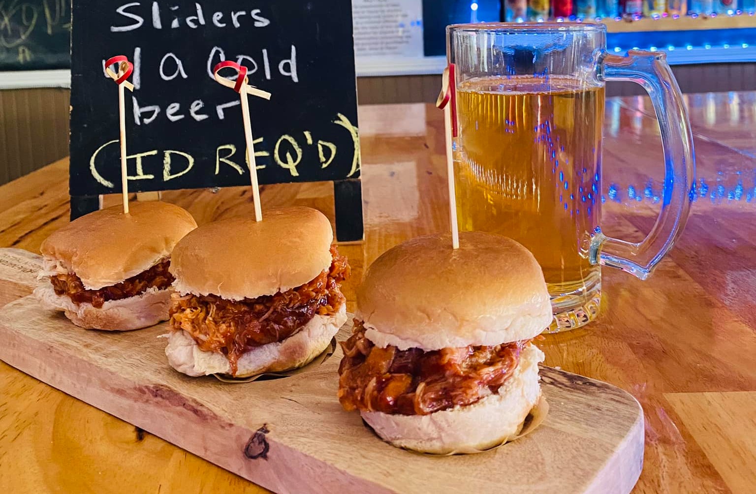 a cut in half sandwich sitting on top of a wooden table