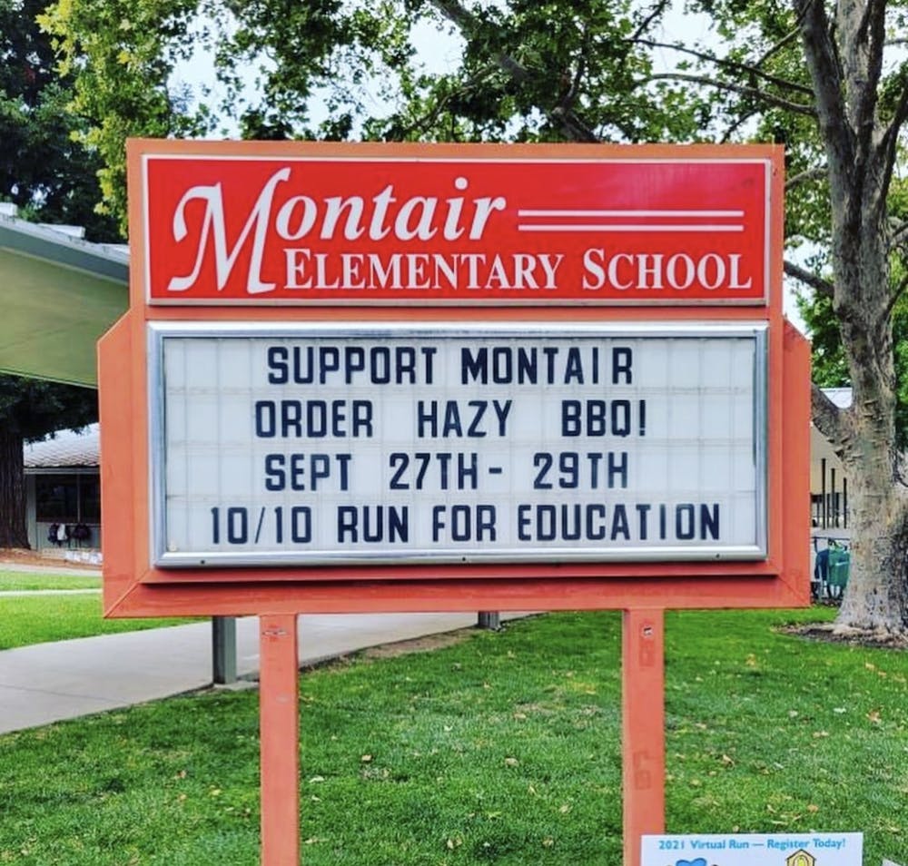 a sign in the middle of a park