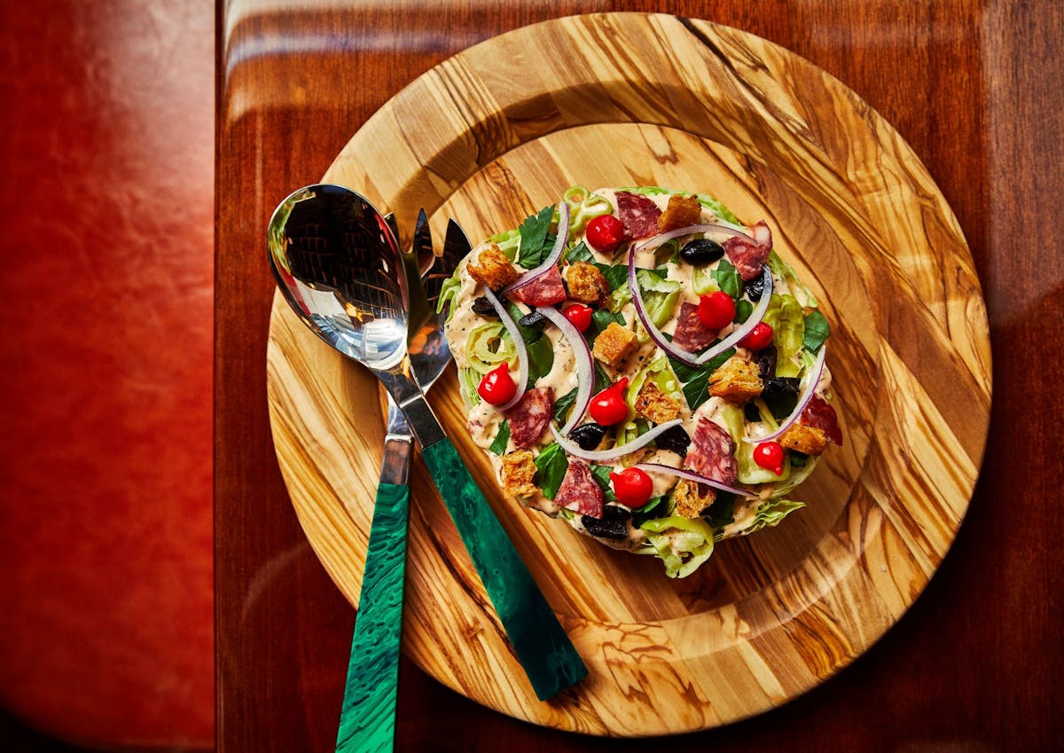 a pizza sitting on top of a wooden table