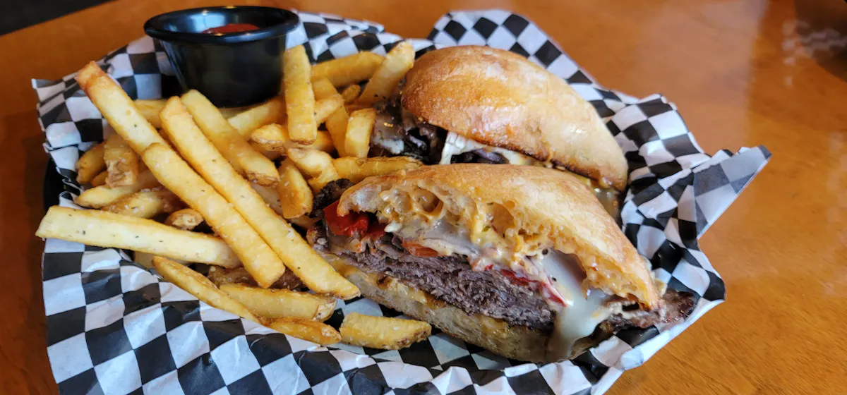 a sandwich and fries on a table