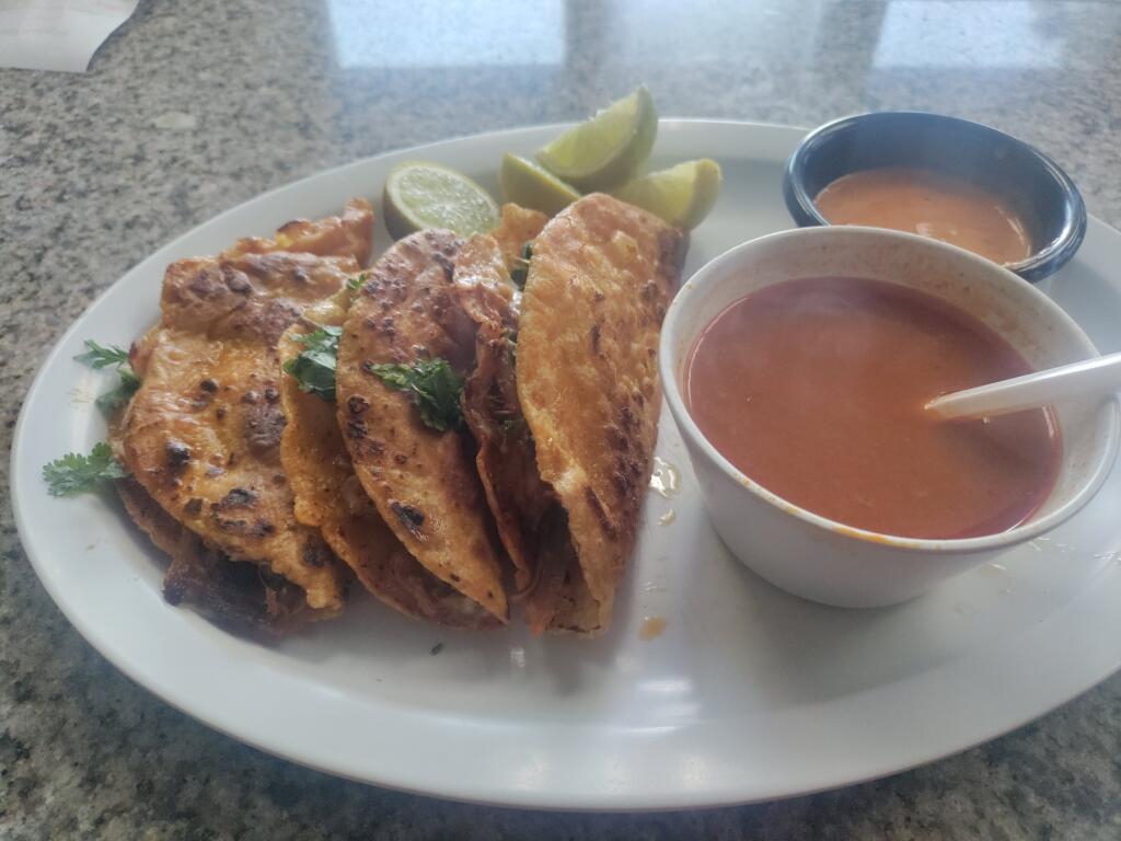 a plate of food and a cup of coffee