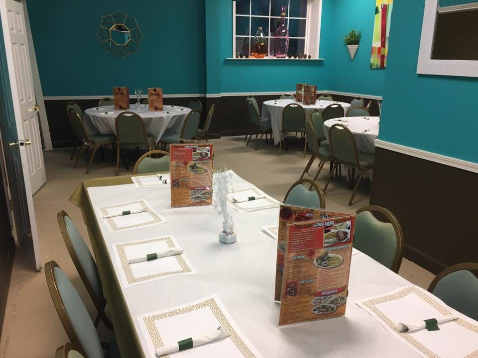 a dining room with tables set with the menus