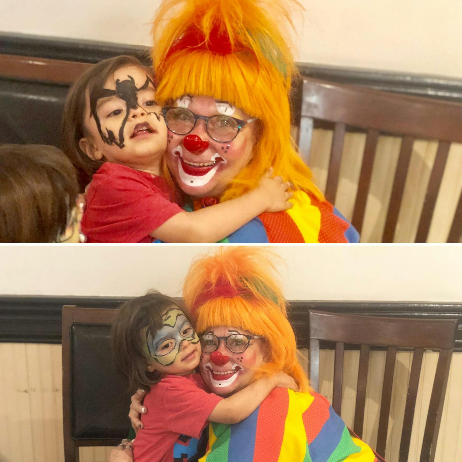 a child hugging clown