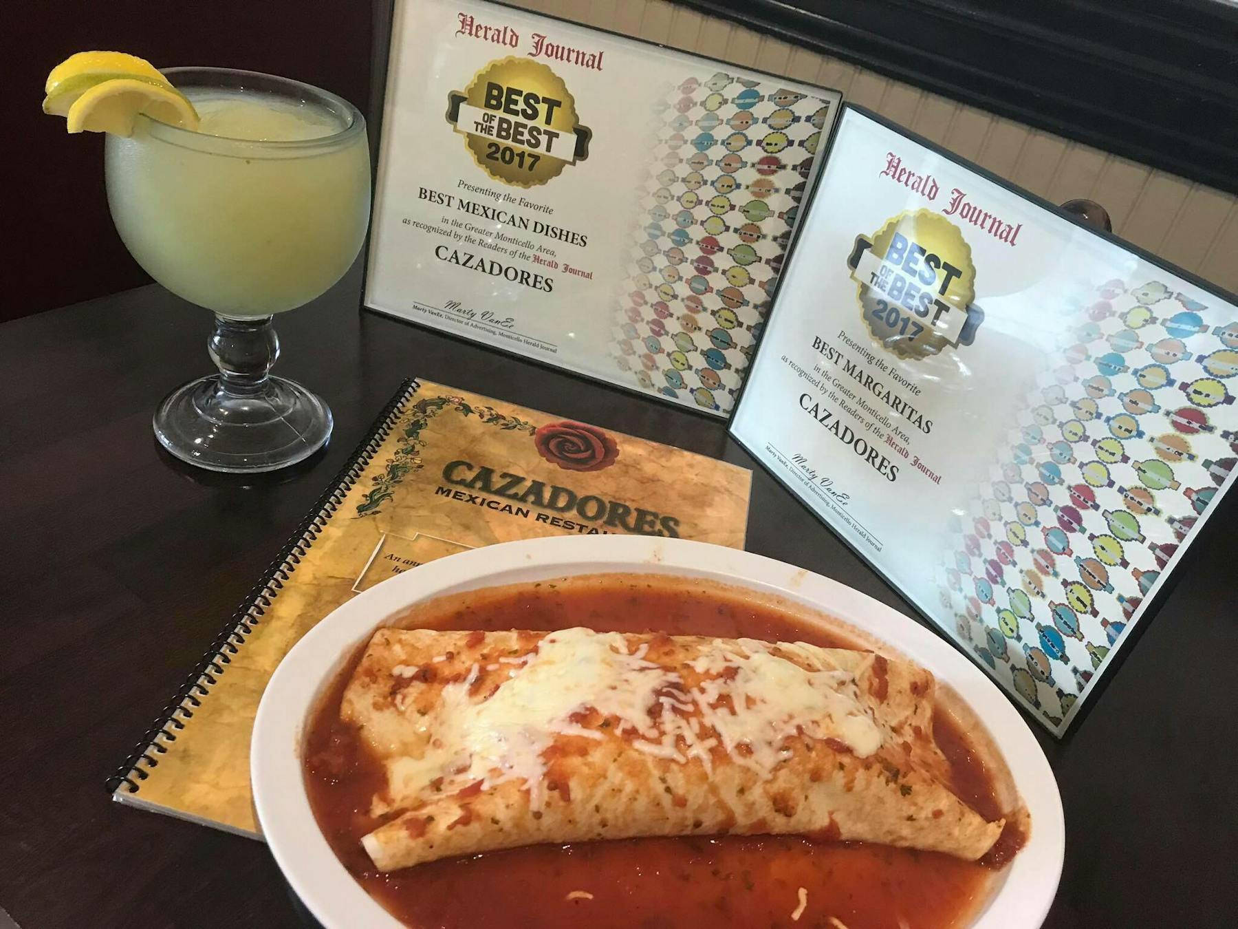 a quesadilla with a margarita and the restaurant's menu