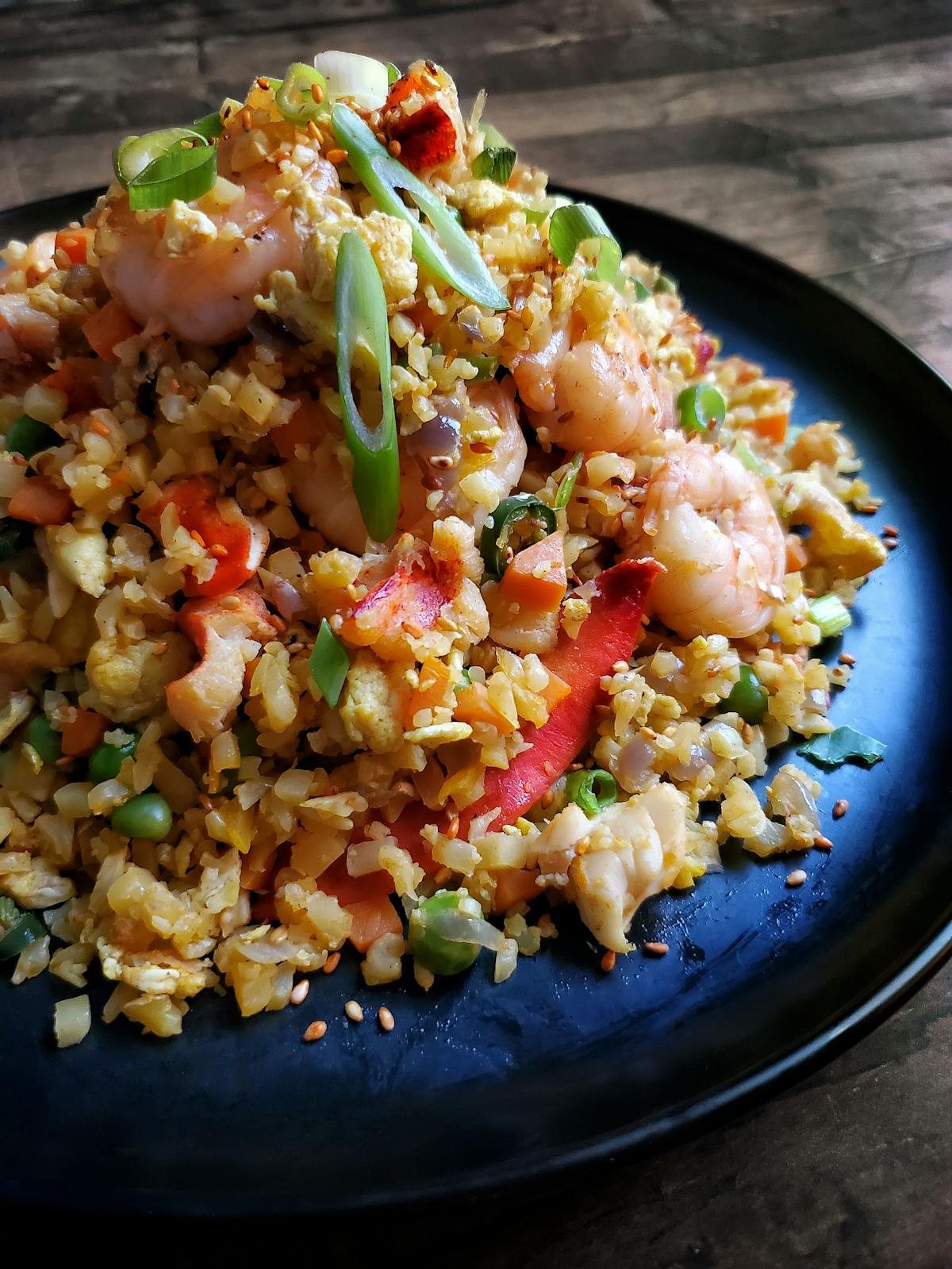 a plate of food with rice and broccoli