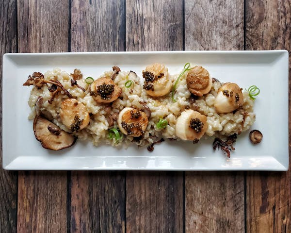 a bunch of food sitting on a wooden surface