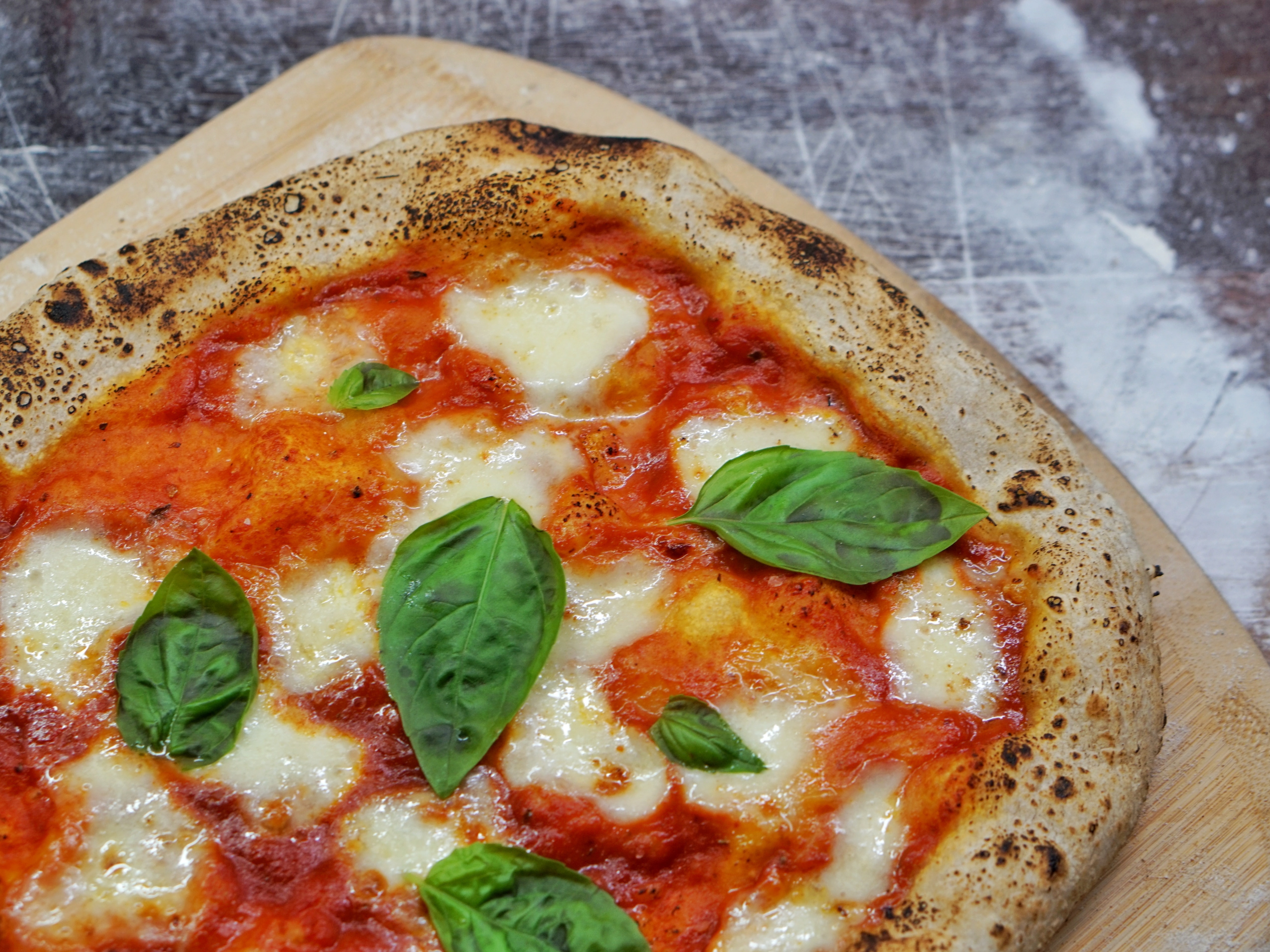a pizza sitting on top of a plate of food