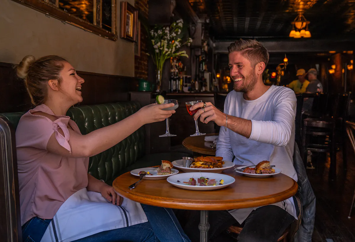 a man sitting at a table in a restaurant