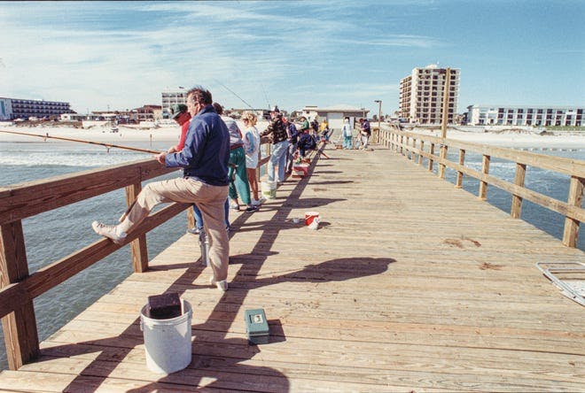 a man standing on a beach