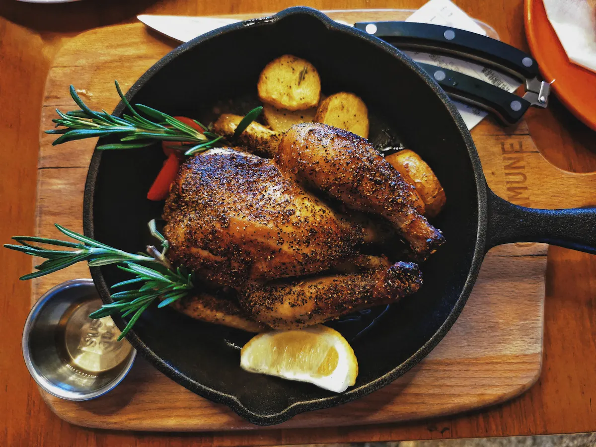 a plate of food sitting on top of a wooden table