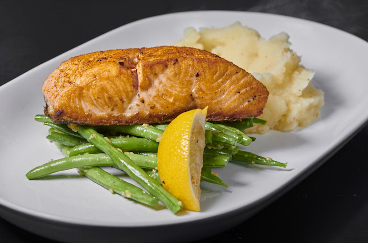 a piece of salmon and puree on a plate