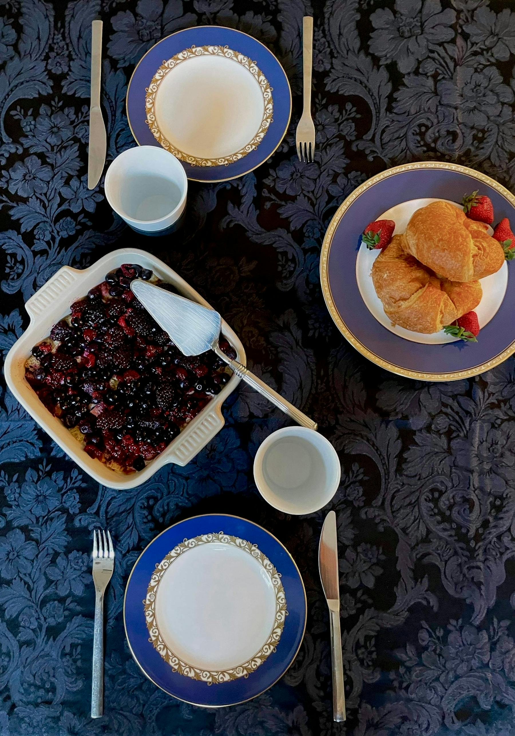 a plate of food and a cup of coffee on a table