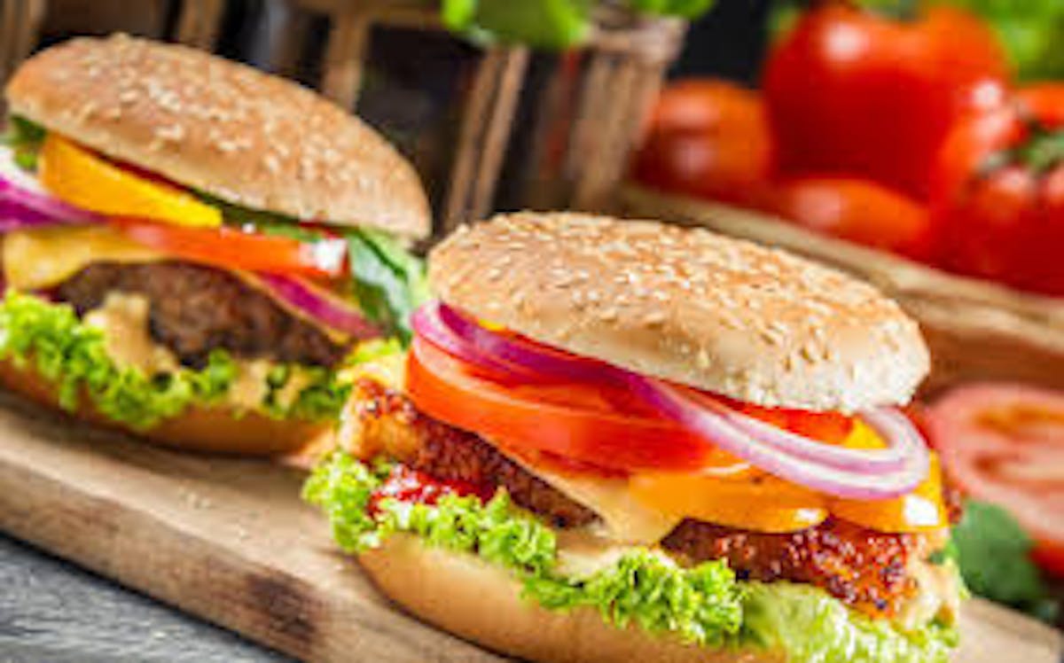 a close up of a sandwich sitting on top of a wooden table