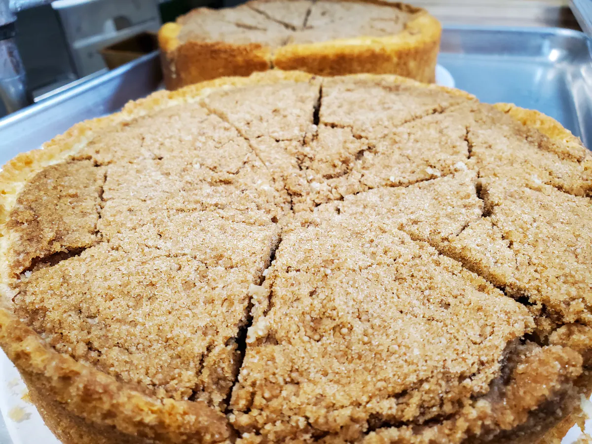 two sliced coffee cakes