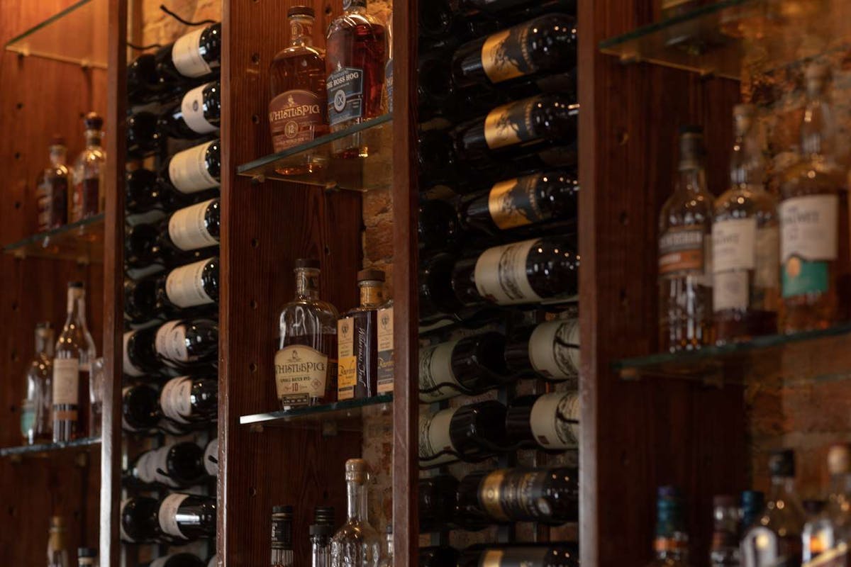 a bottle of wine on a shelf