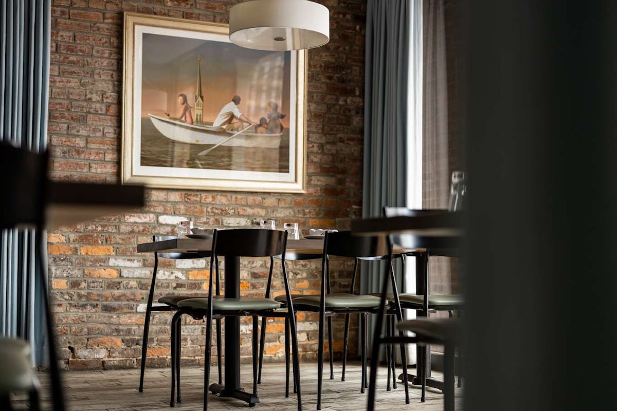 a dining room table in front of a window
