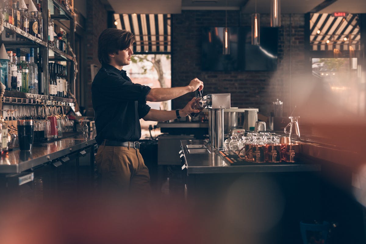 a person standing in front of a table