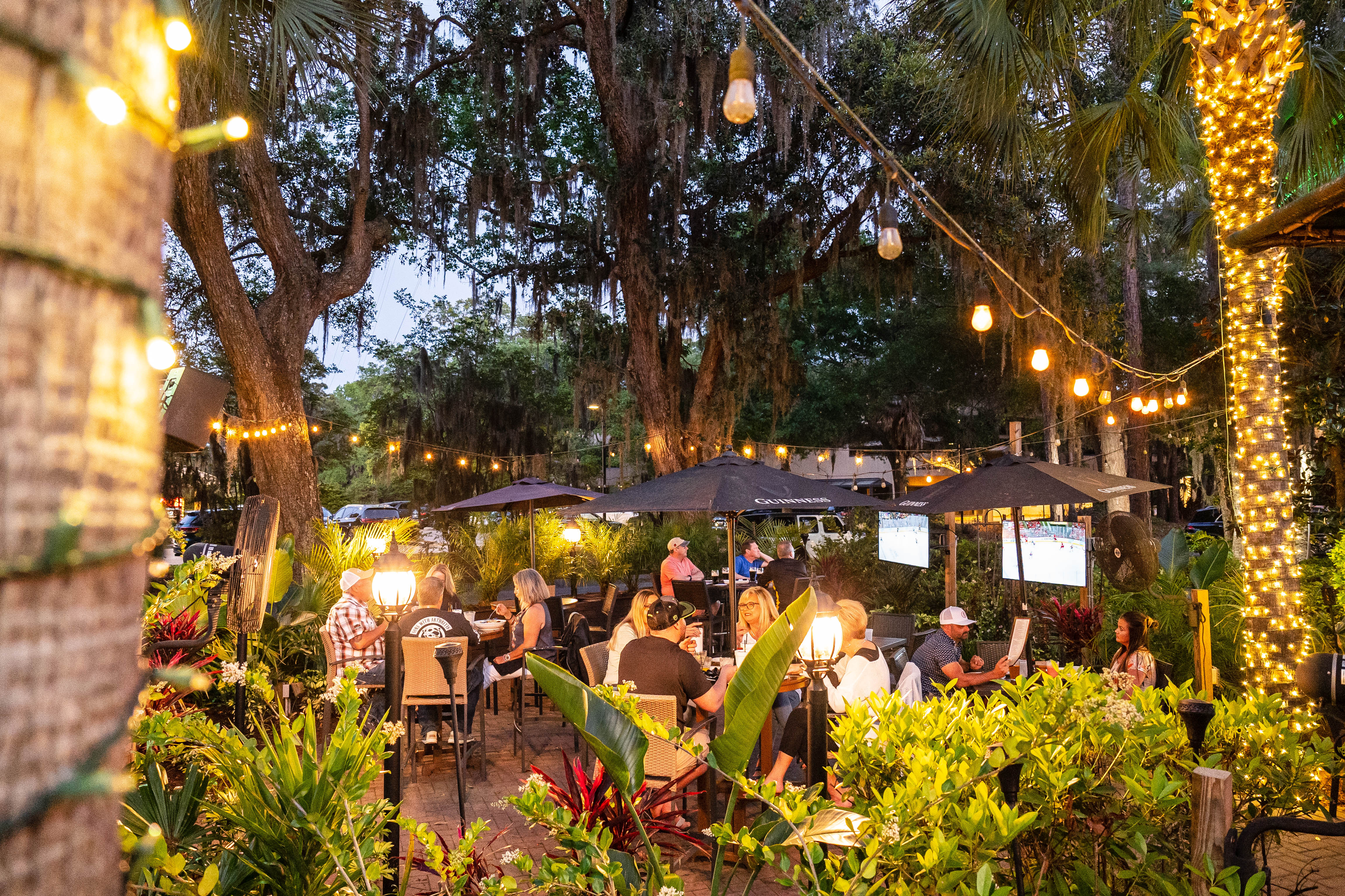 a group of people standing in a garden