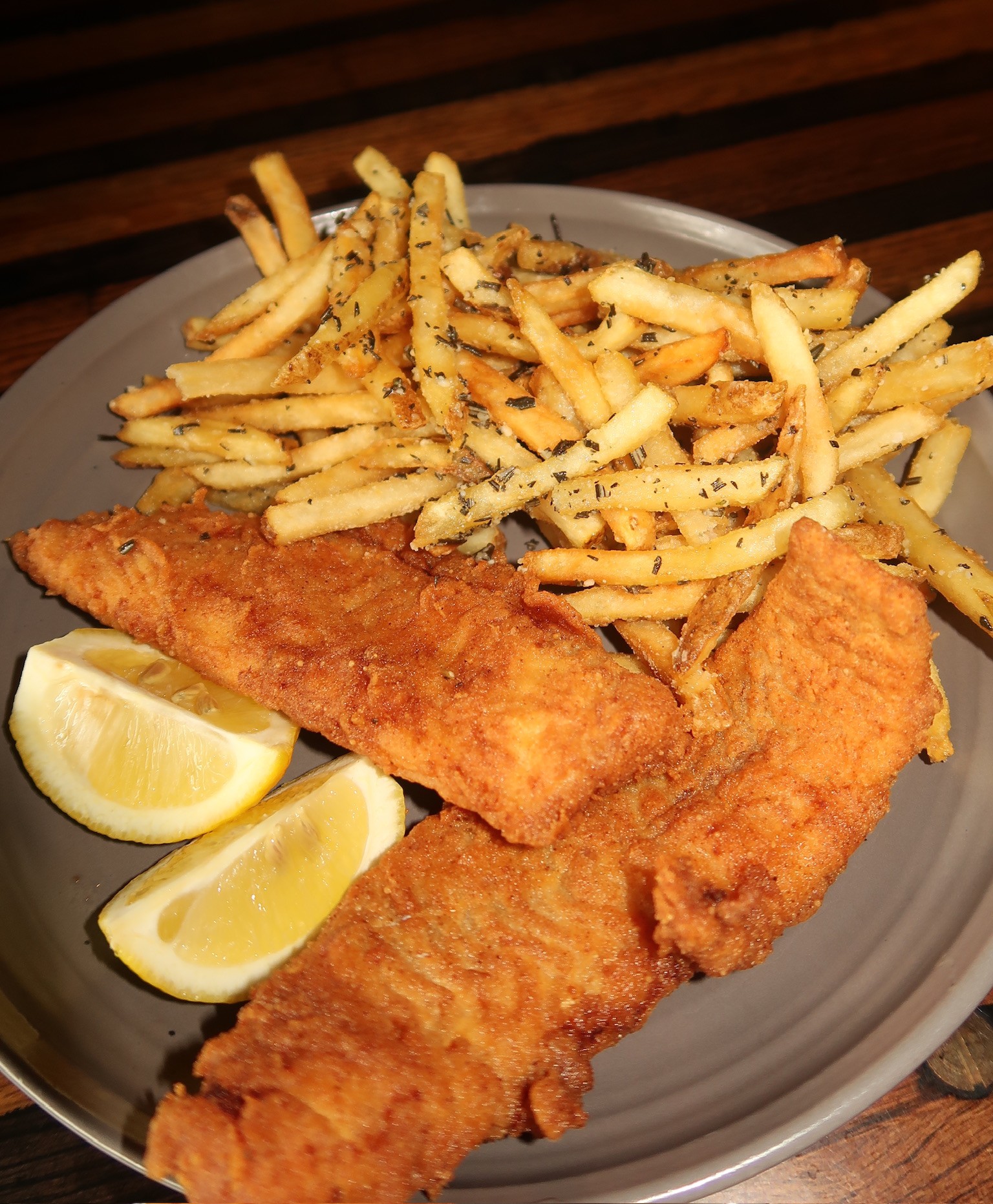 a plate of fried fish and fries