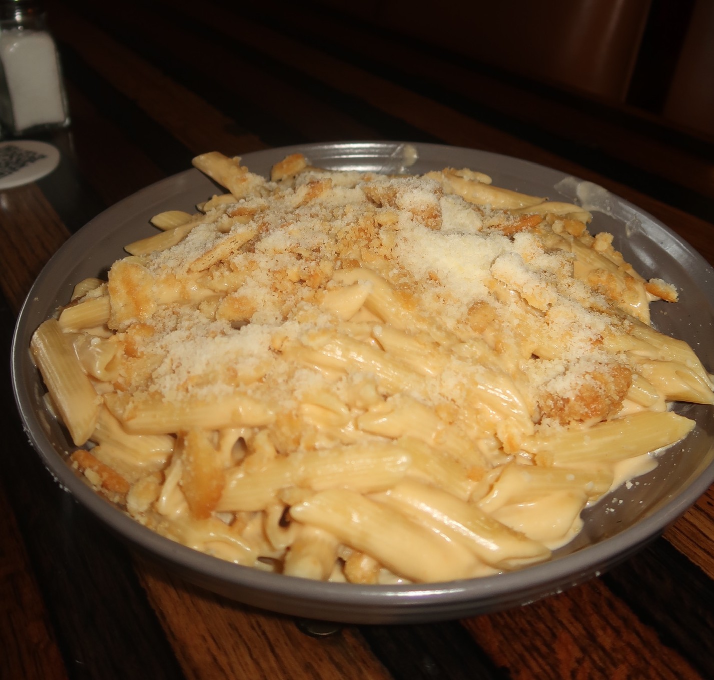 a plate of pasta with cheese on it