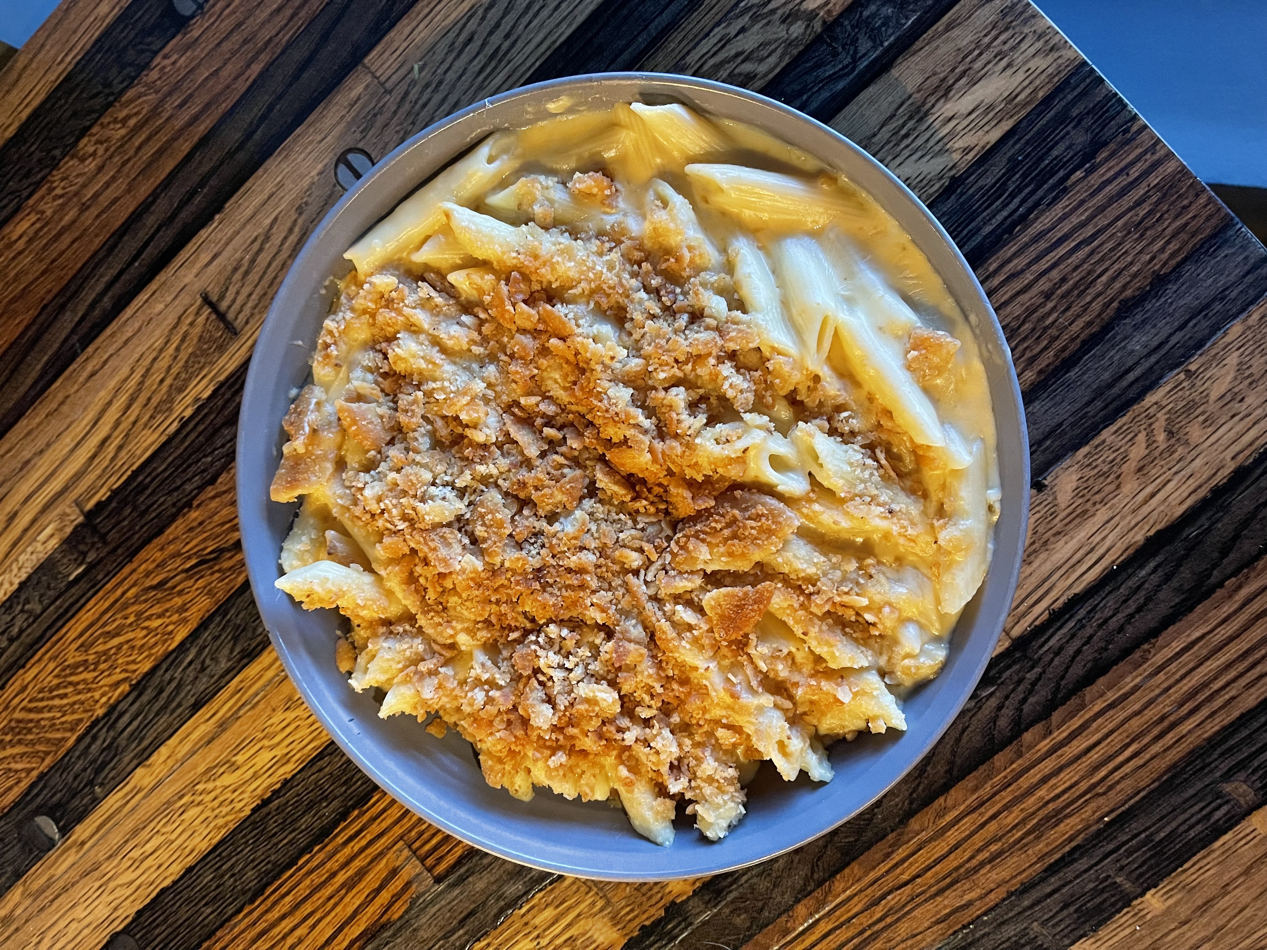 a plate of food sitting on top of a wooden table