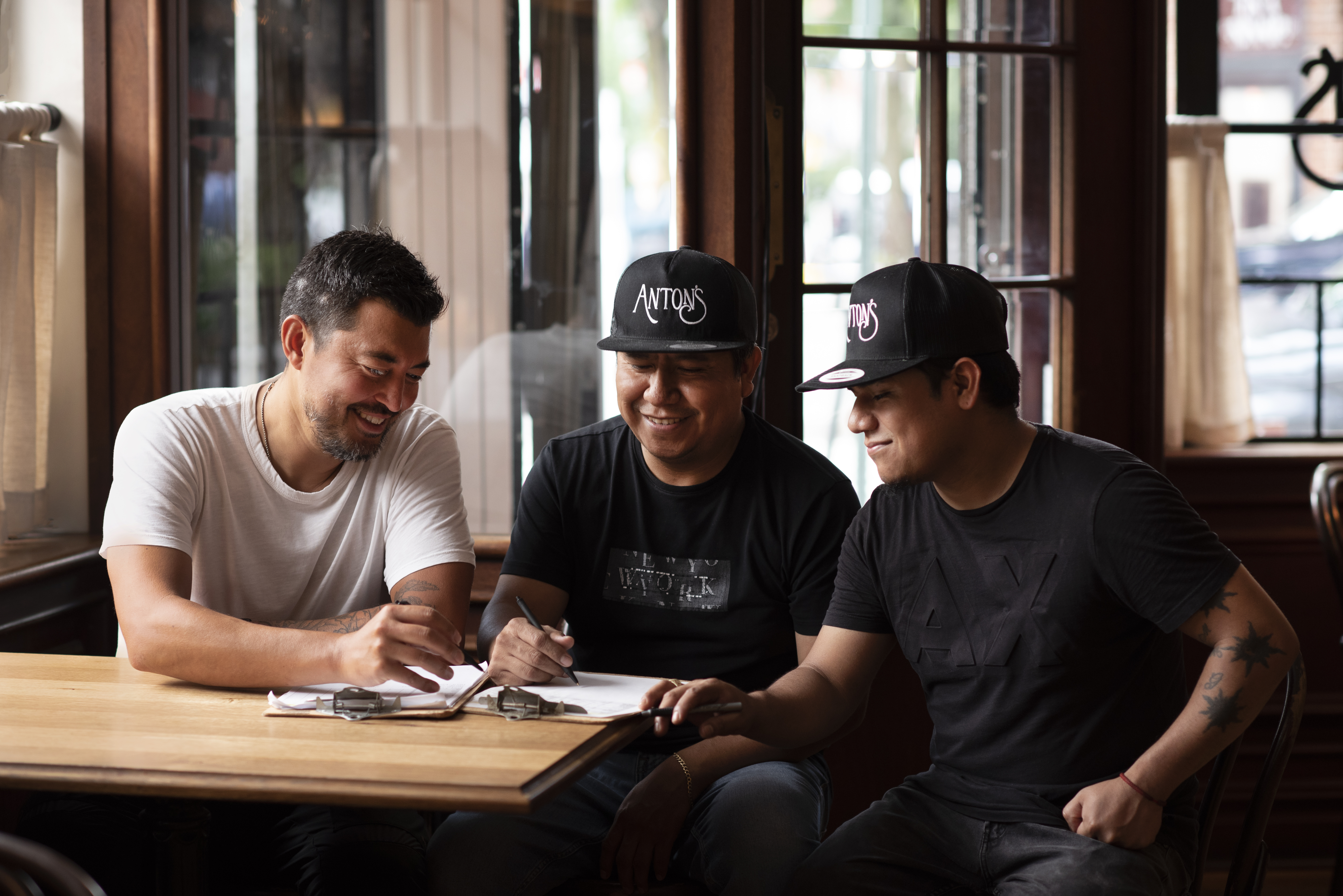 a group of people sitting at a table