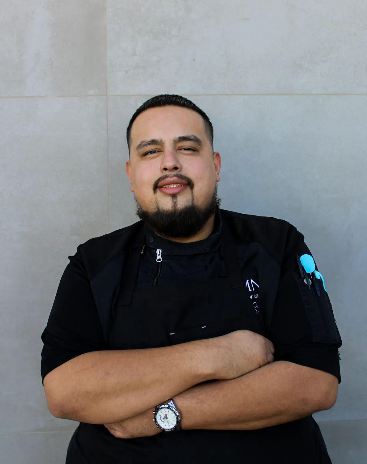 a man with a beard and black shirt