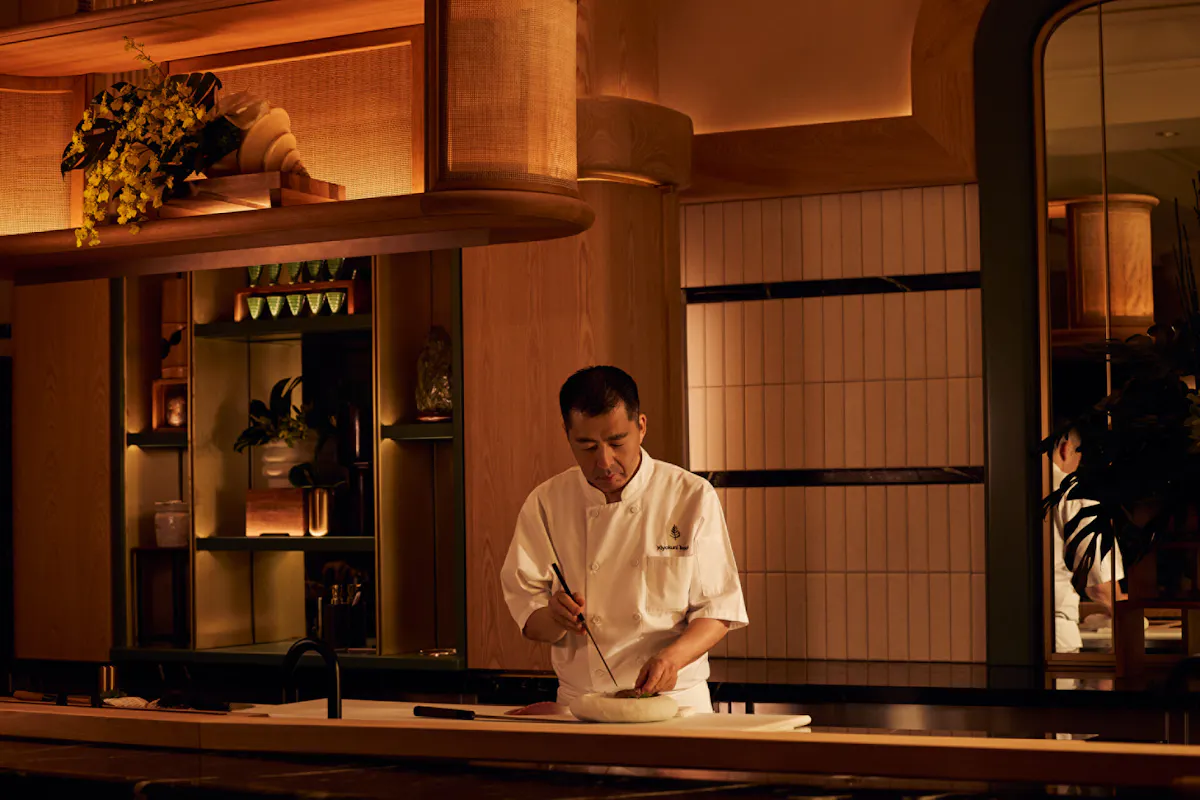 a man standing in front of a counter
