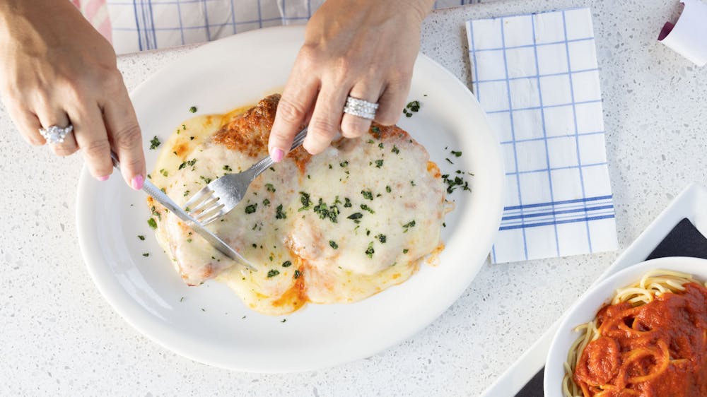 a person holding a plate of food