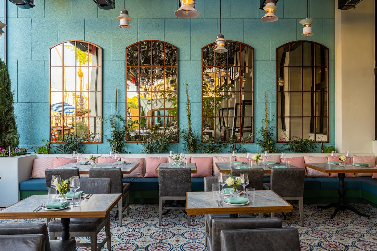a room filled with furniture and vase on a table
