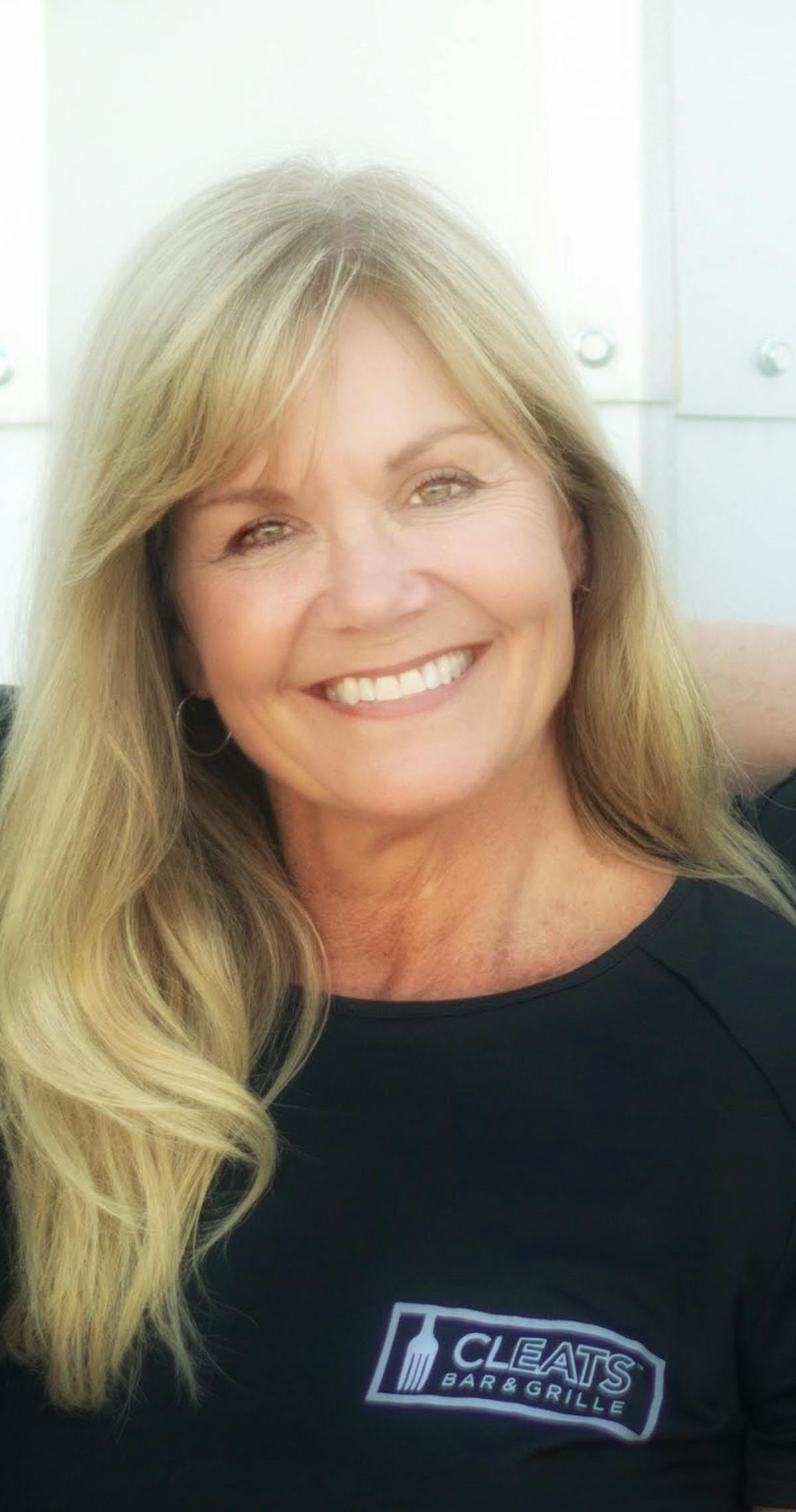 a woman smiling for the camera