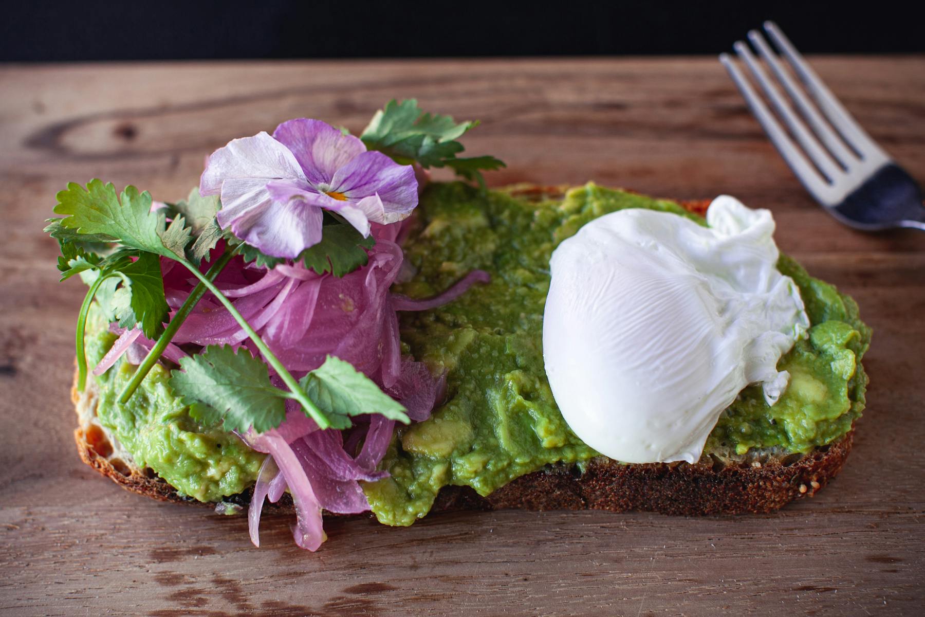 toast with avocado spread and poached egg