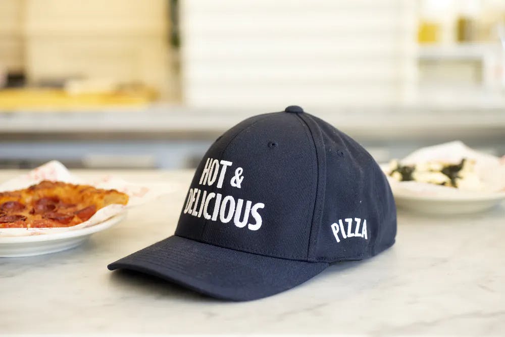 a close up of a slice of pizza sitting on top of a table