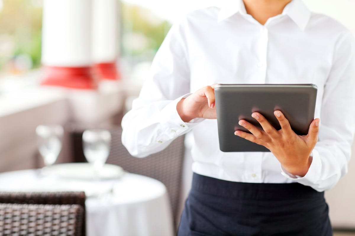 a person holding a tablet