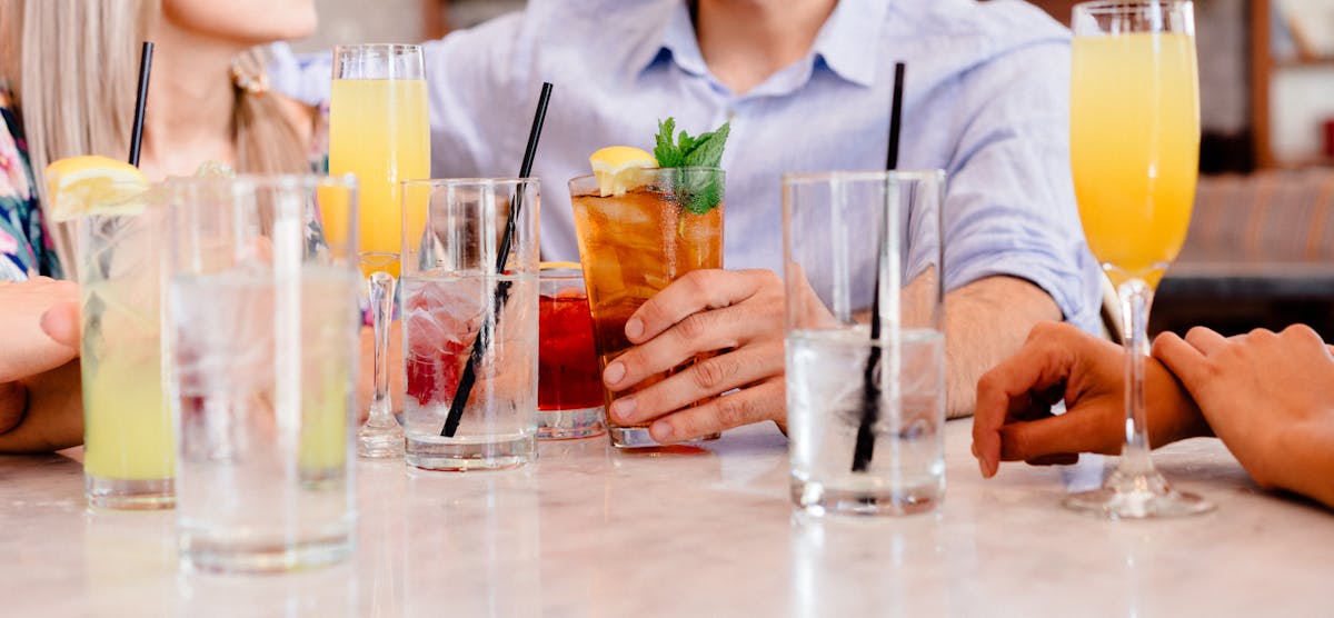 a group of people drinking cocktails 