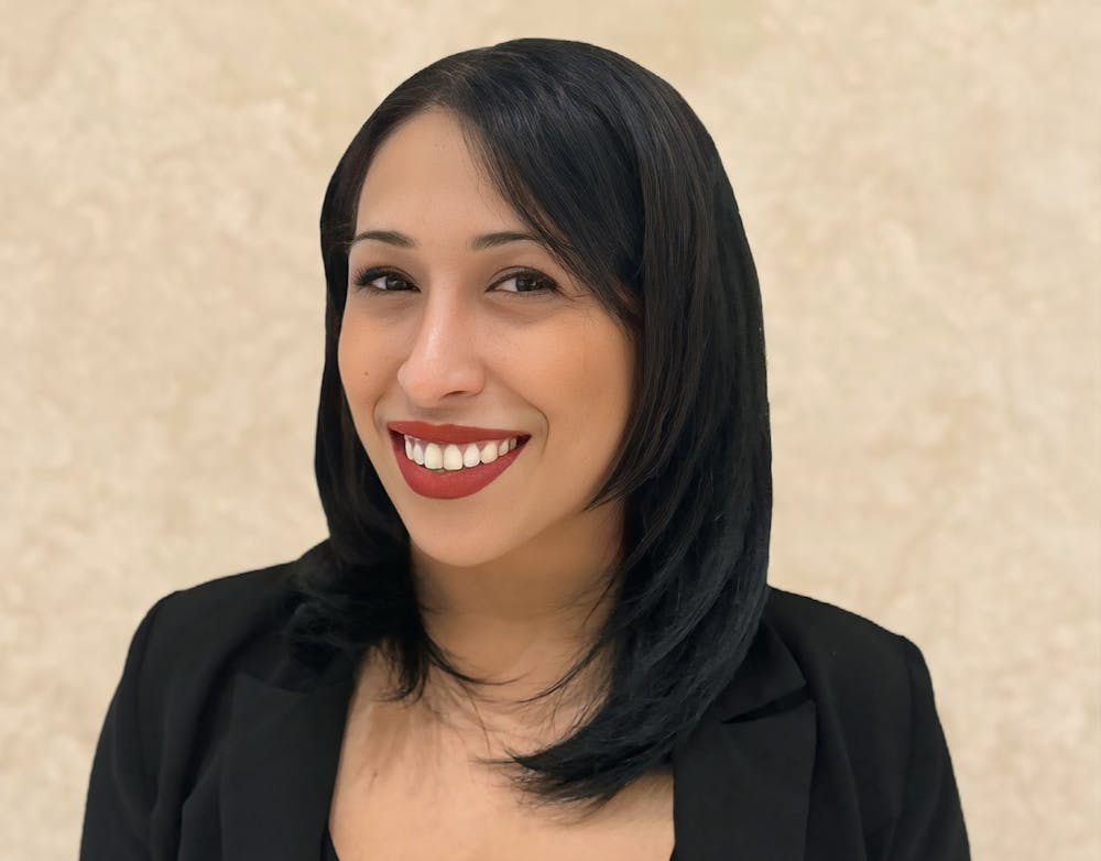 a woman who is smiling and looking at the camera