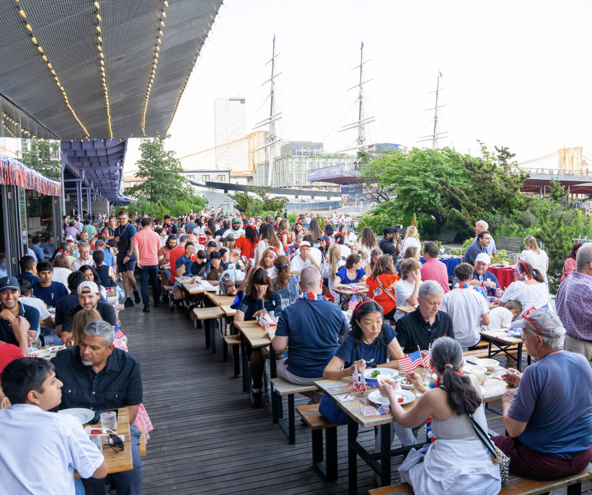 Guests enjoying July 4th food and drinks at Industry Kitchen