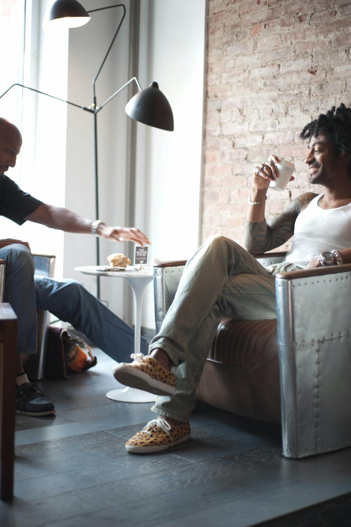 a man and a woman sitting on a table