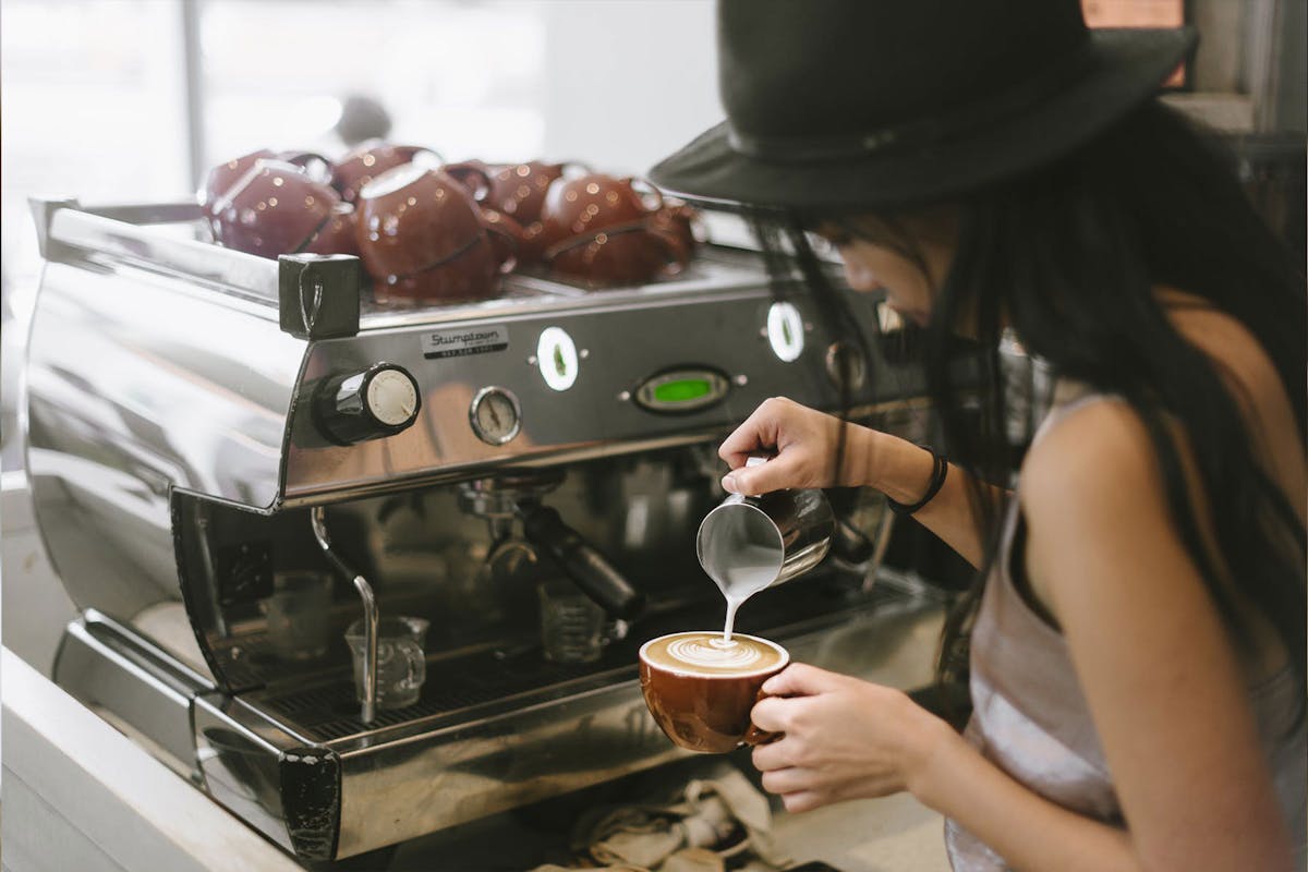 a woman preparing food in a kitchen