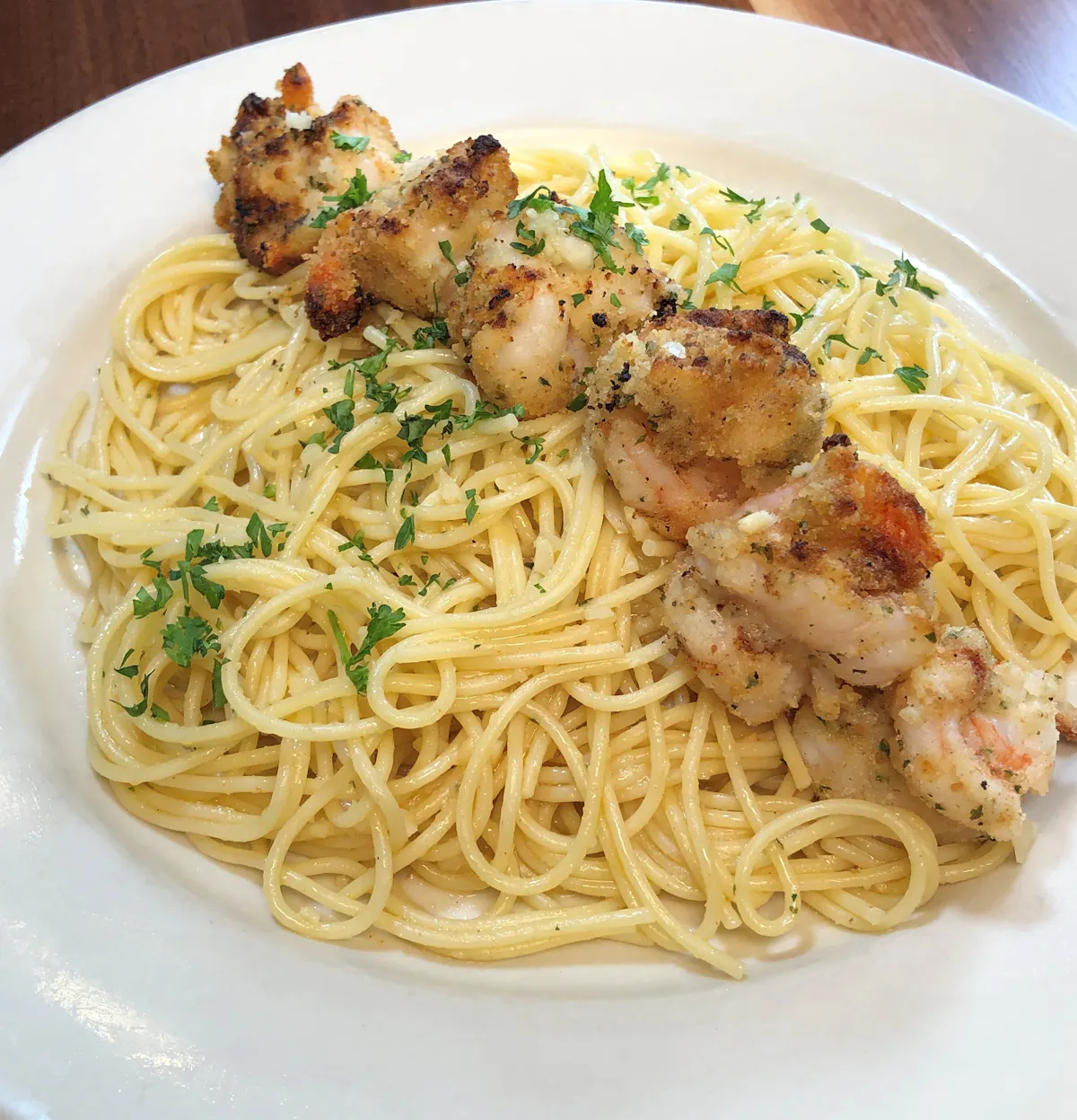 a white plate topped with pasta