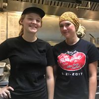 A Pasta House Co. team member serving guests