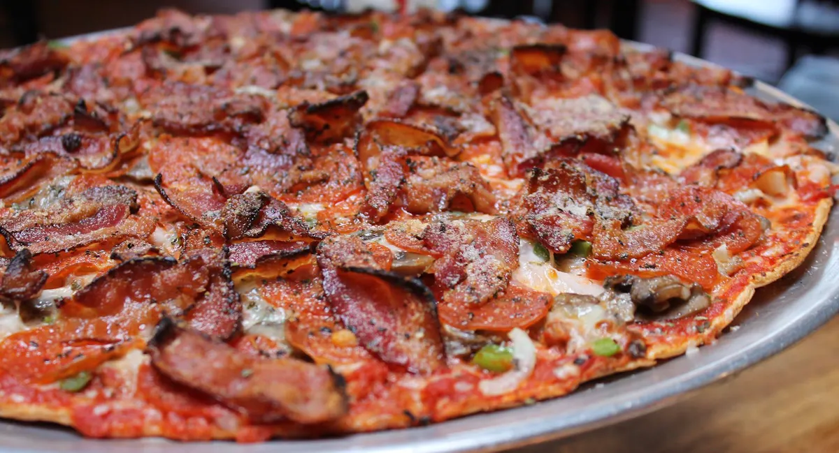 a close up of a slice of pizza