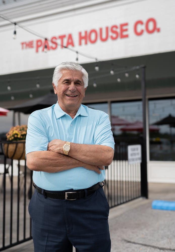 a man standing in front of a building